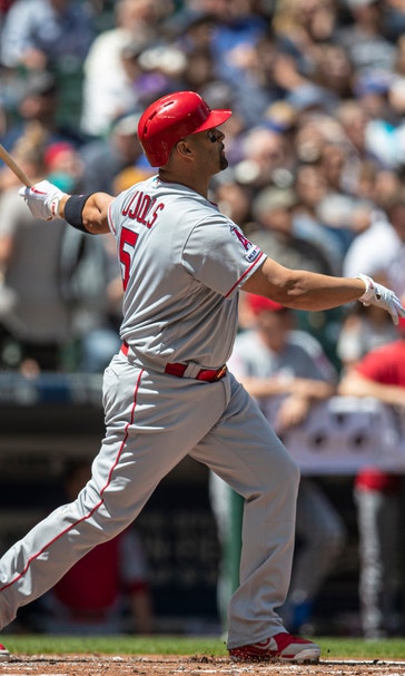 Pujols HR, Suarez wins in debut, Angels rout Mariners 13-3